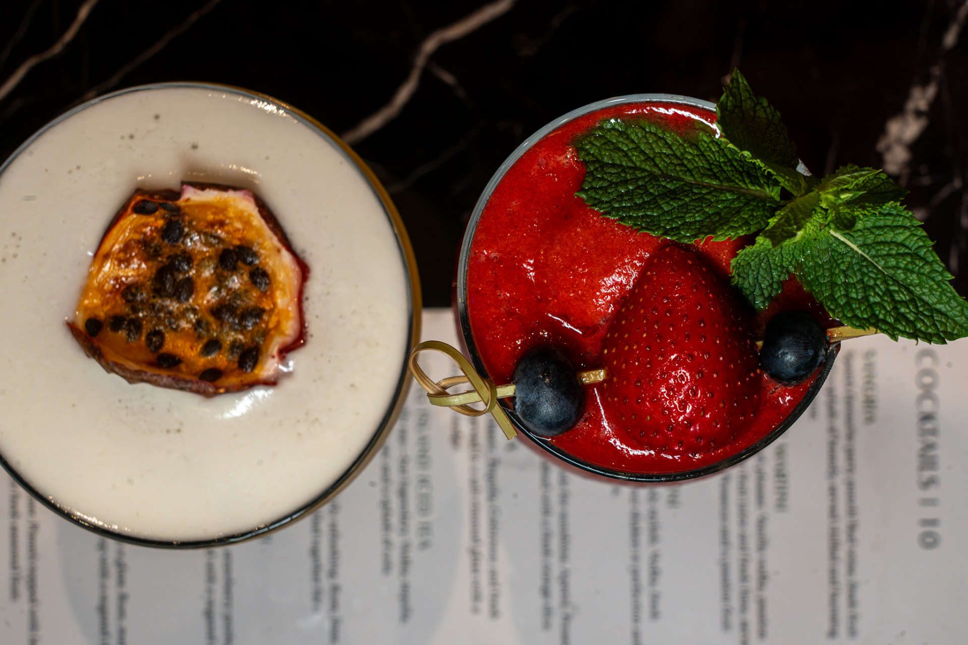 Two colourful cocktails served at Nova