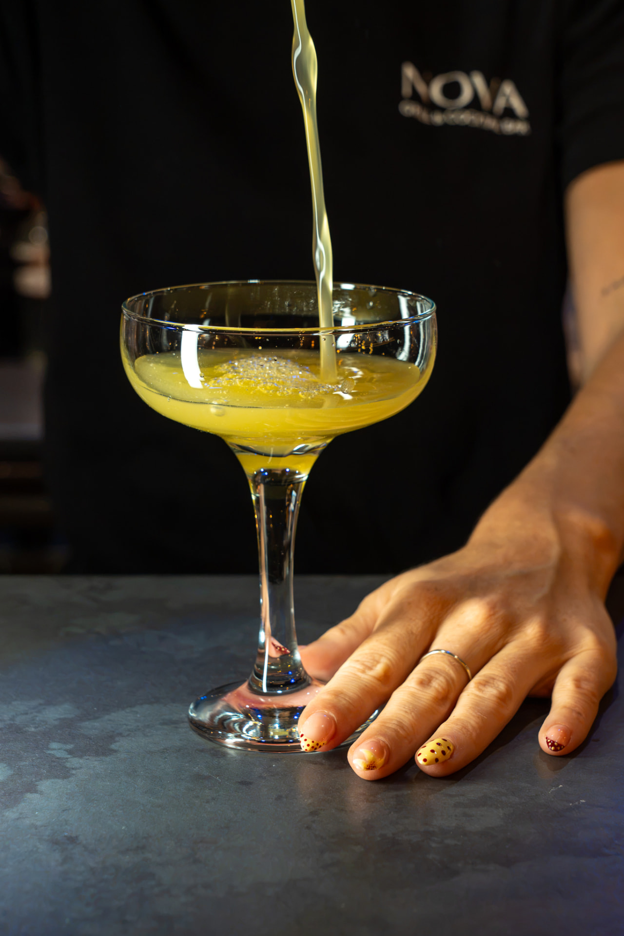 A cocktail being poured at the Nova bar