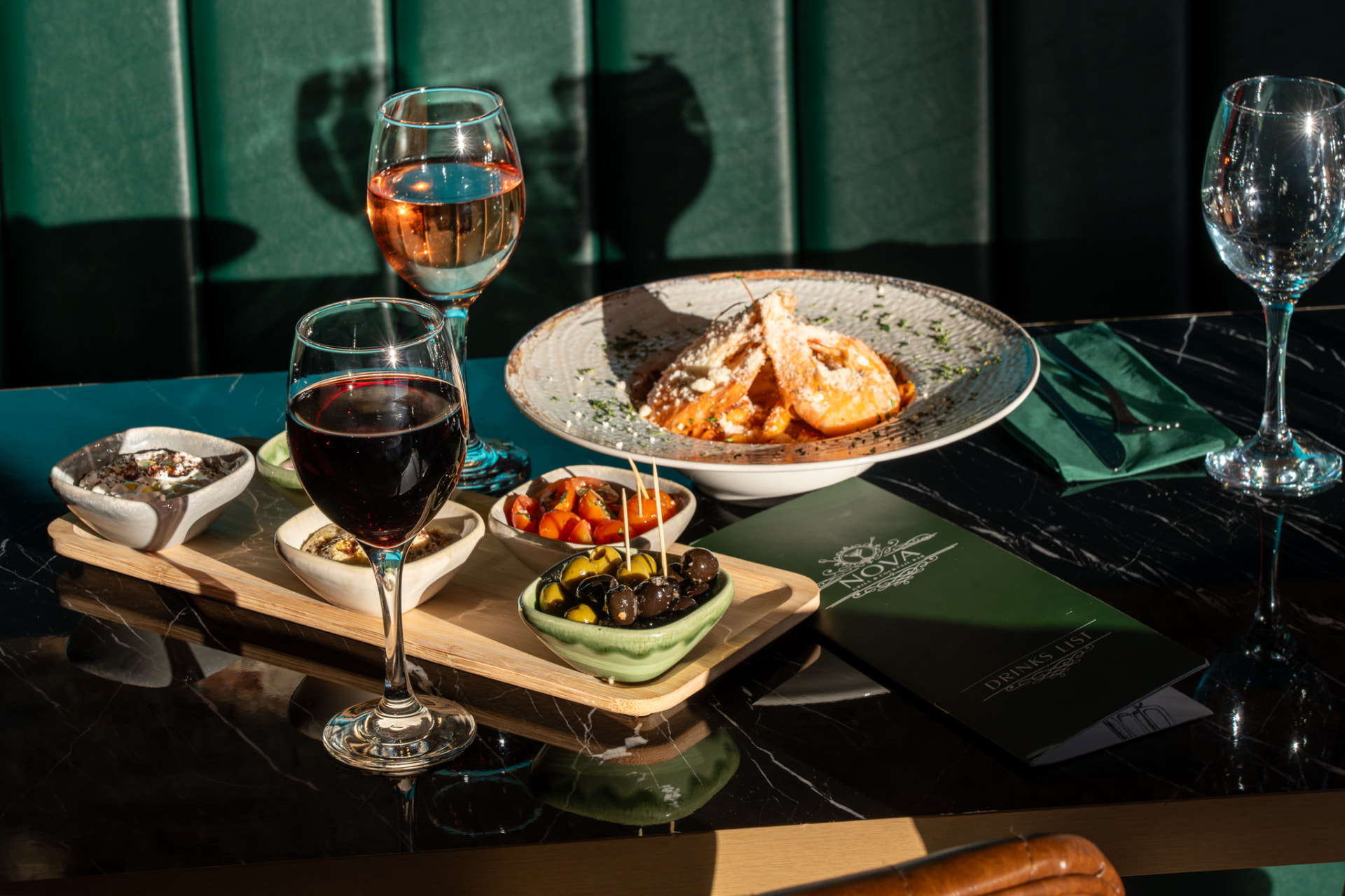 A table of mezze, dips and wine at Nova Grill & Cocktail Bar